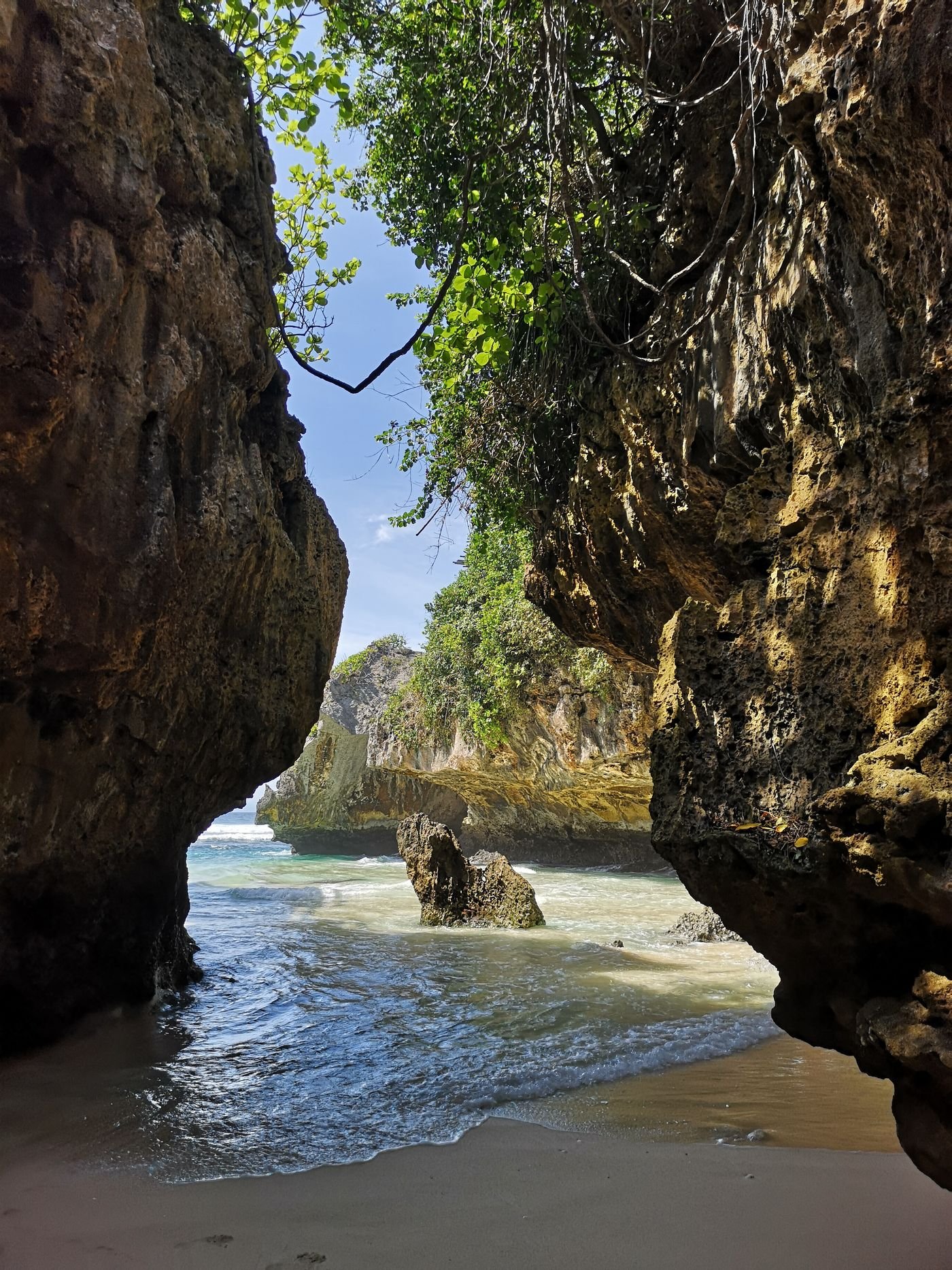 Suluban Blue Point Beach Uluwatu Bali — dramatic sea cave and limestone cliff entrance