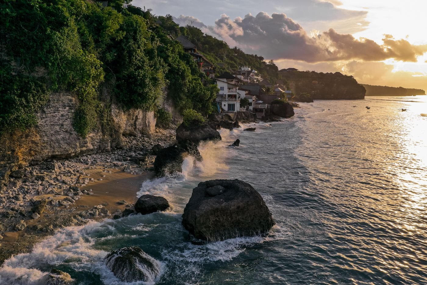 Uluwatu cliffs Bali — dramatic limestone coastline above the famous surf break